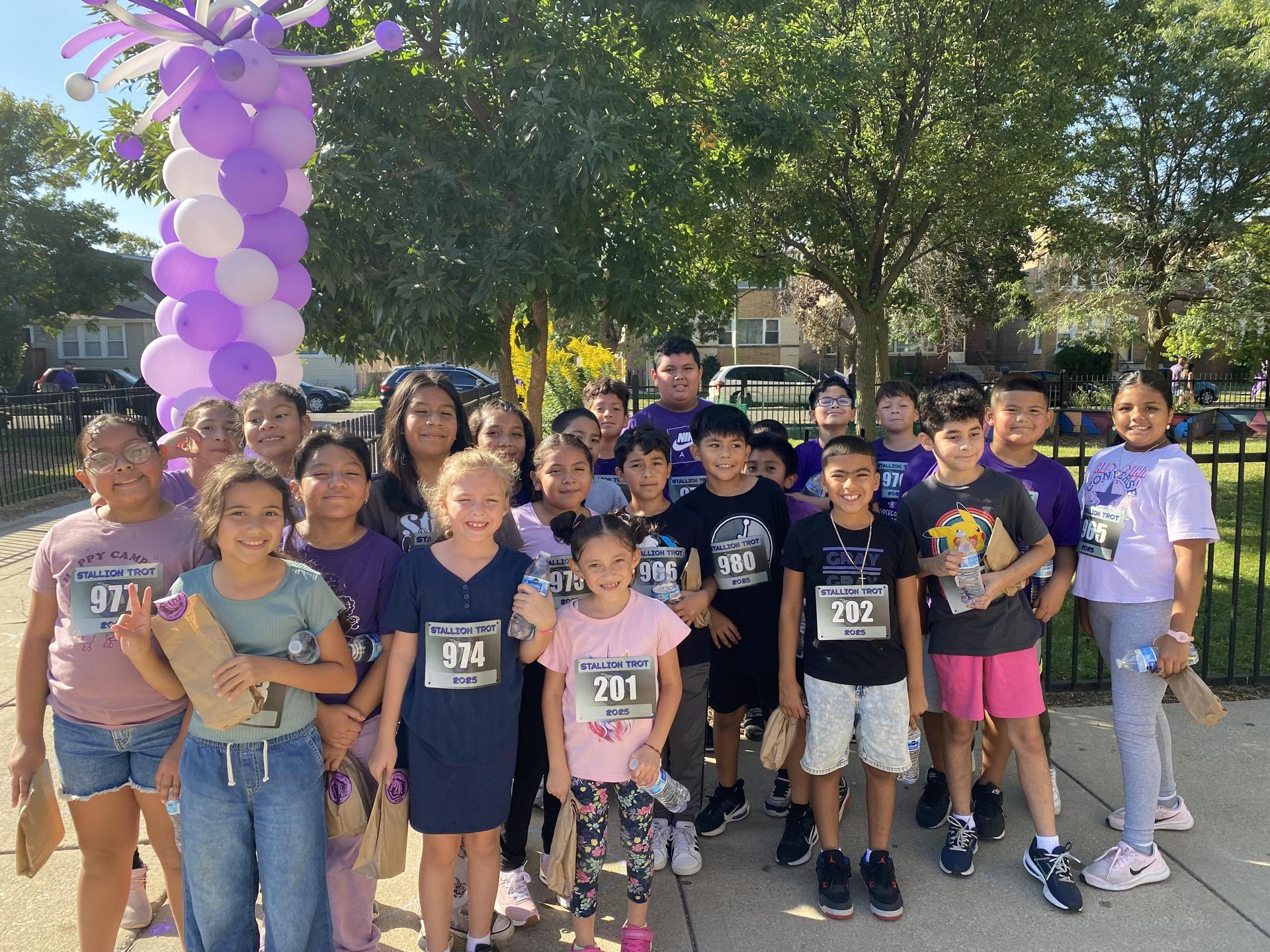 Students from Room 308 stand posing after the Stallion Trot