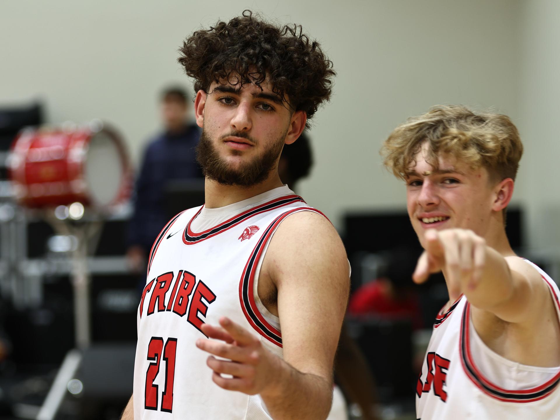 Varsity boys playing basketball against yosemite