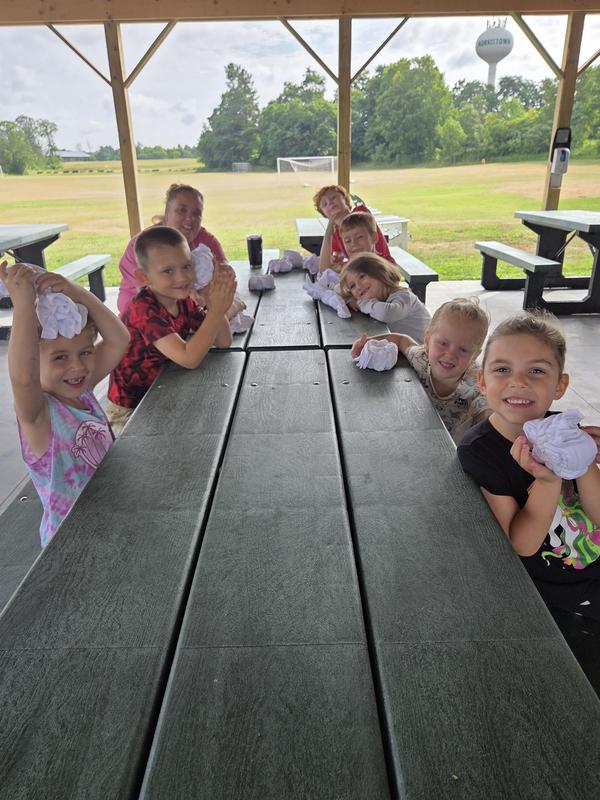MCS students sit at a picnic table