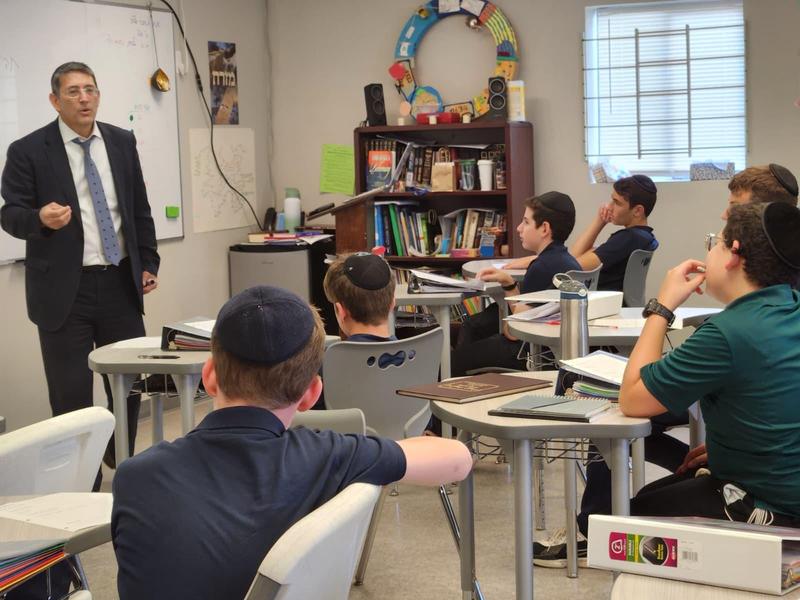 The boys listen intently as Rabbi Silverman teaches about