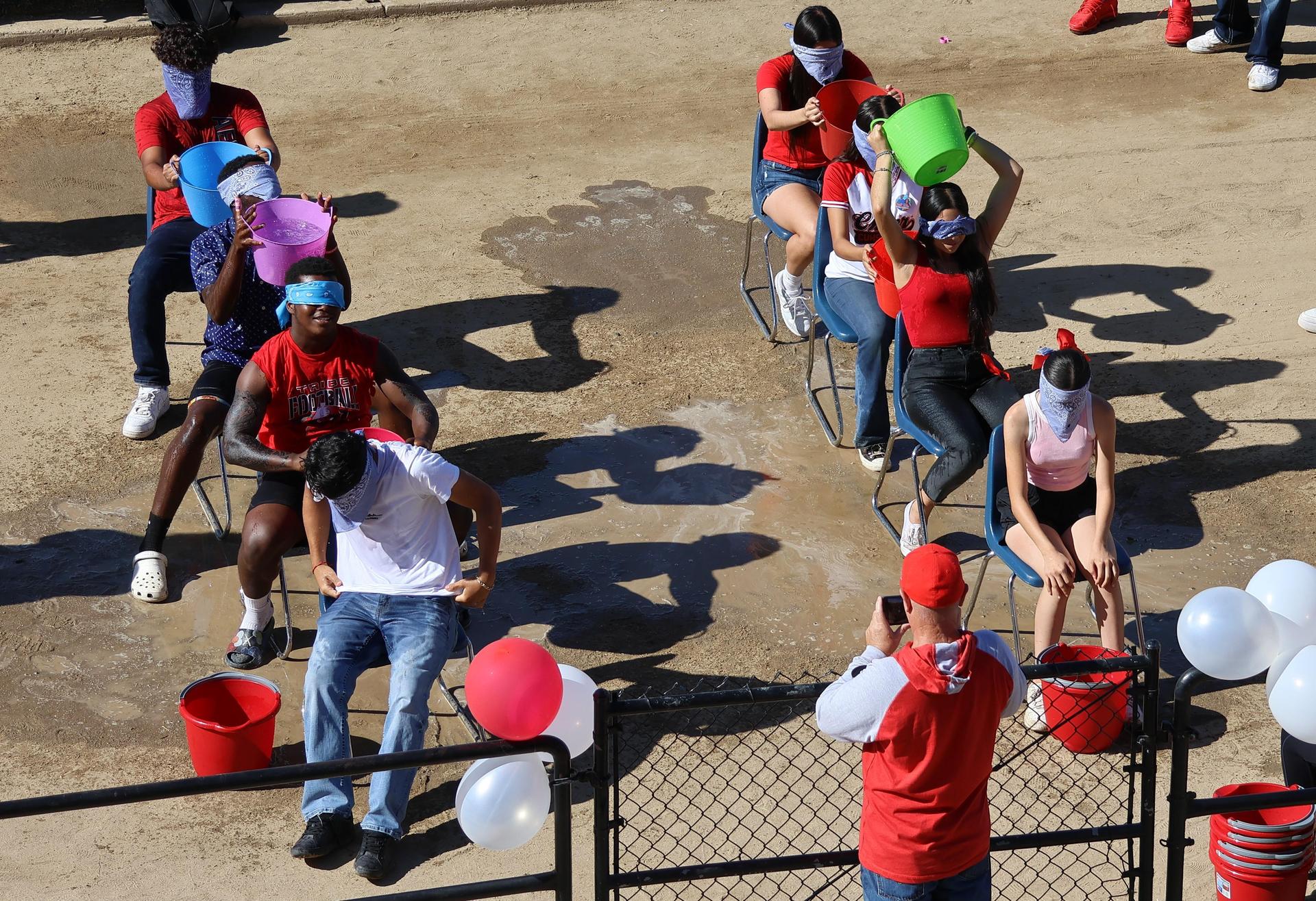 students and staff at the homecoming rally