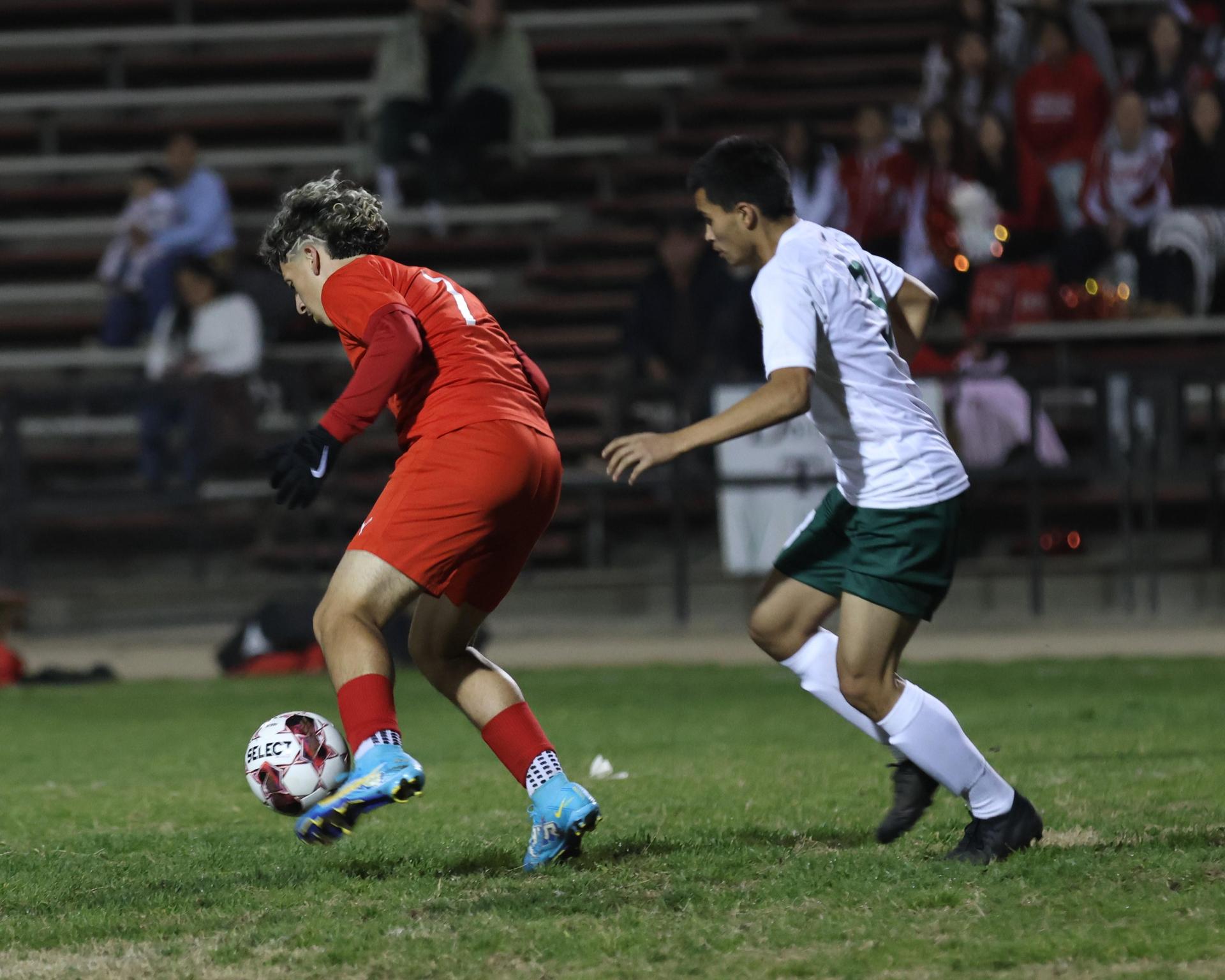 Varsity boys play soccer against Kingsburg
