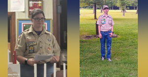 one girl and one boy in scouting uniforms