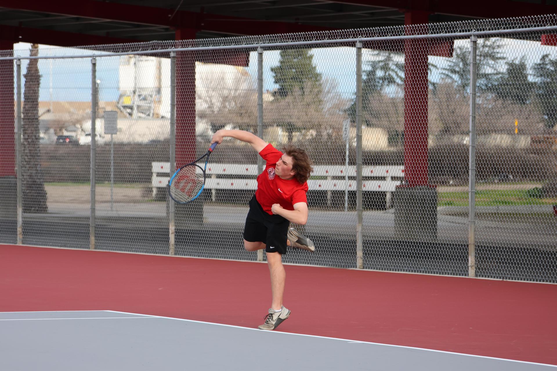 CUHS Boys playing tennis against coalinga