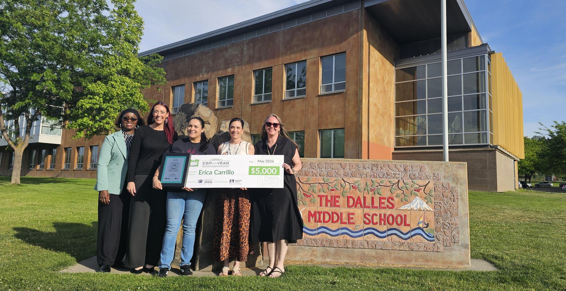 Staff with award in front of The Dalles Middle School