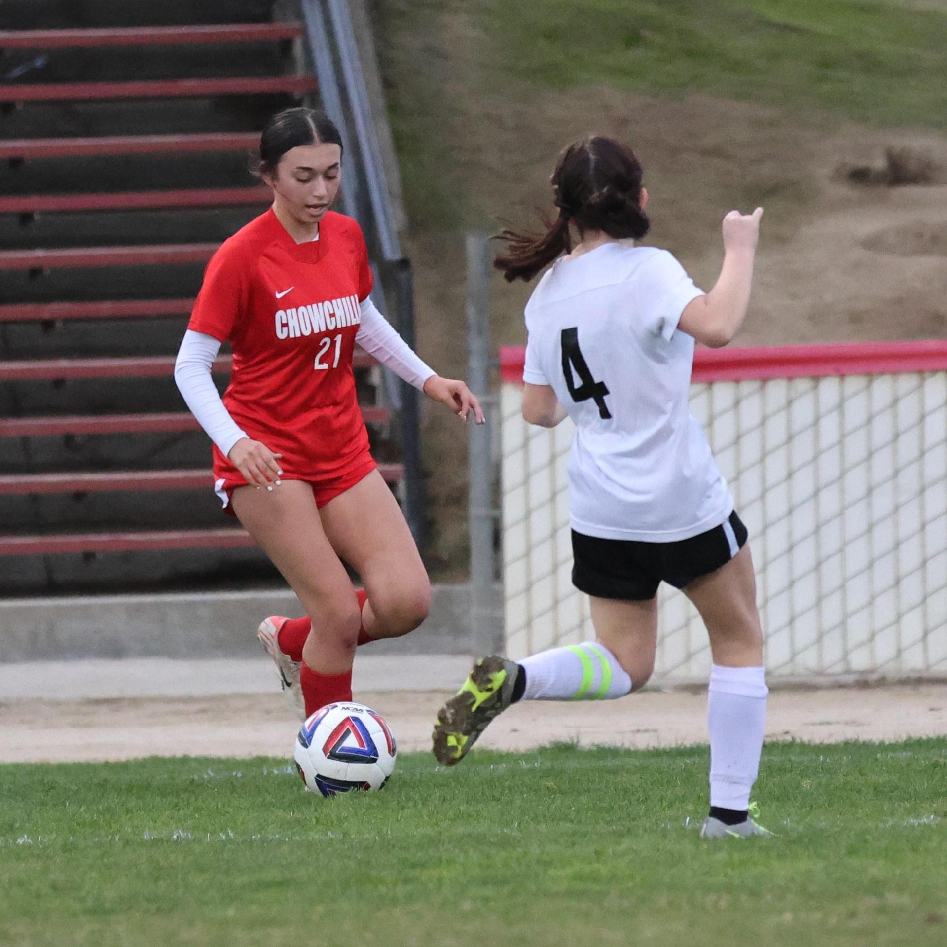 Junior varsity girls playing soccer against liberty