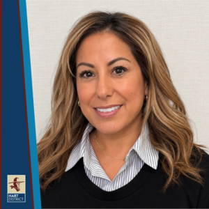 Desiree Torres, a woman with brown hair smiling.