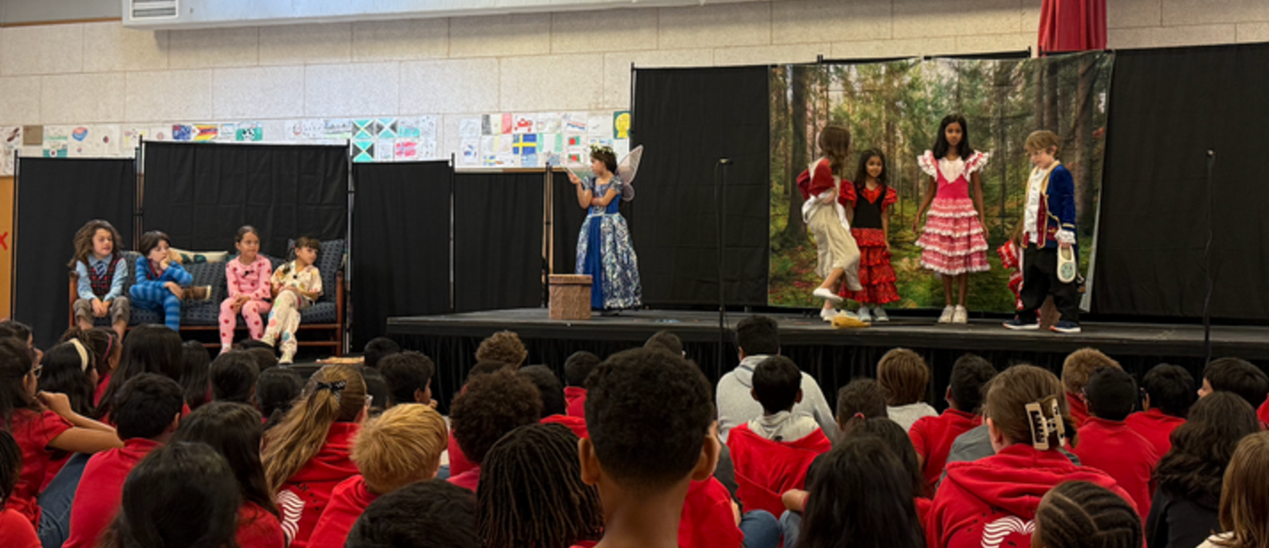 Students perform a play in front of their peers
