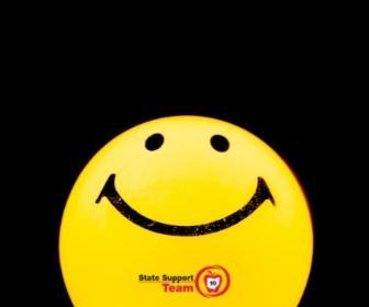 yellow balloon with smiley face