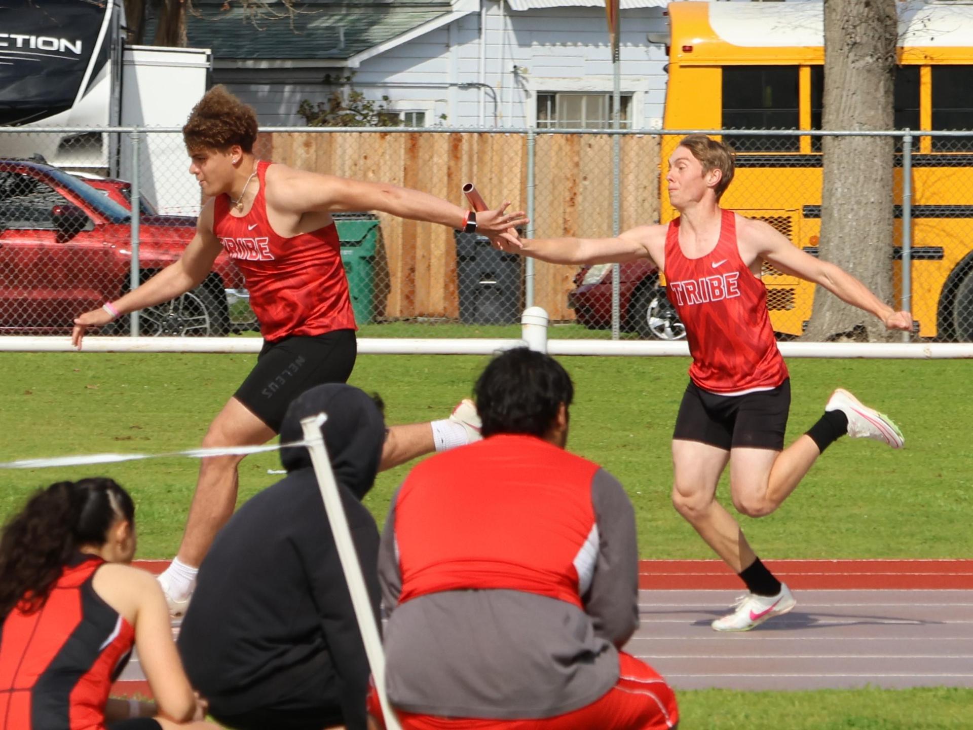 varsity boys running the four by 100 meter relay