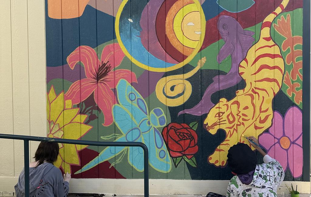 students painting mural