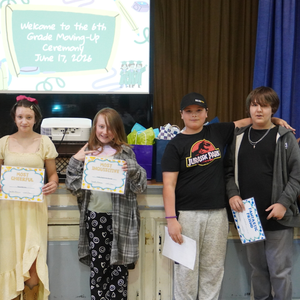 4 students with certificates