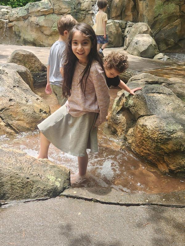 A TDSA student wading at the Fernbank museum.