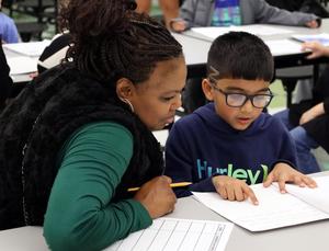 Buchanan Elementary students share writing with adults.