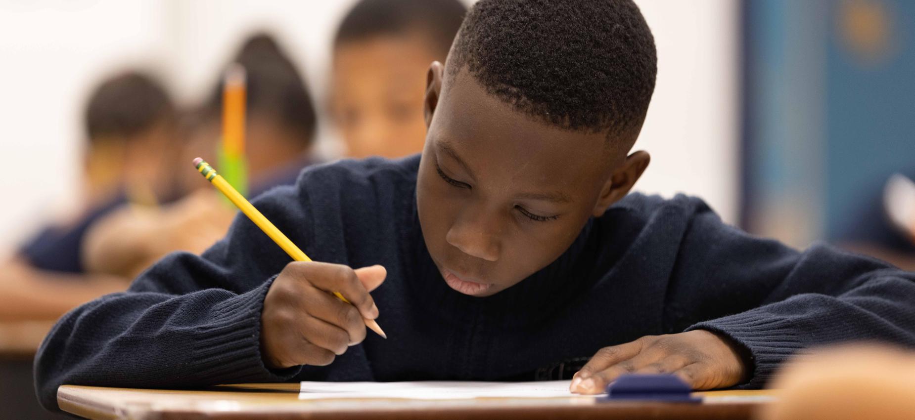 Scholars at work, writing and reading.