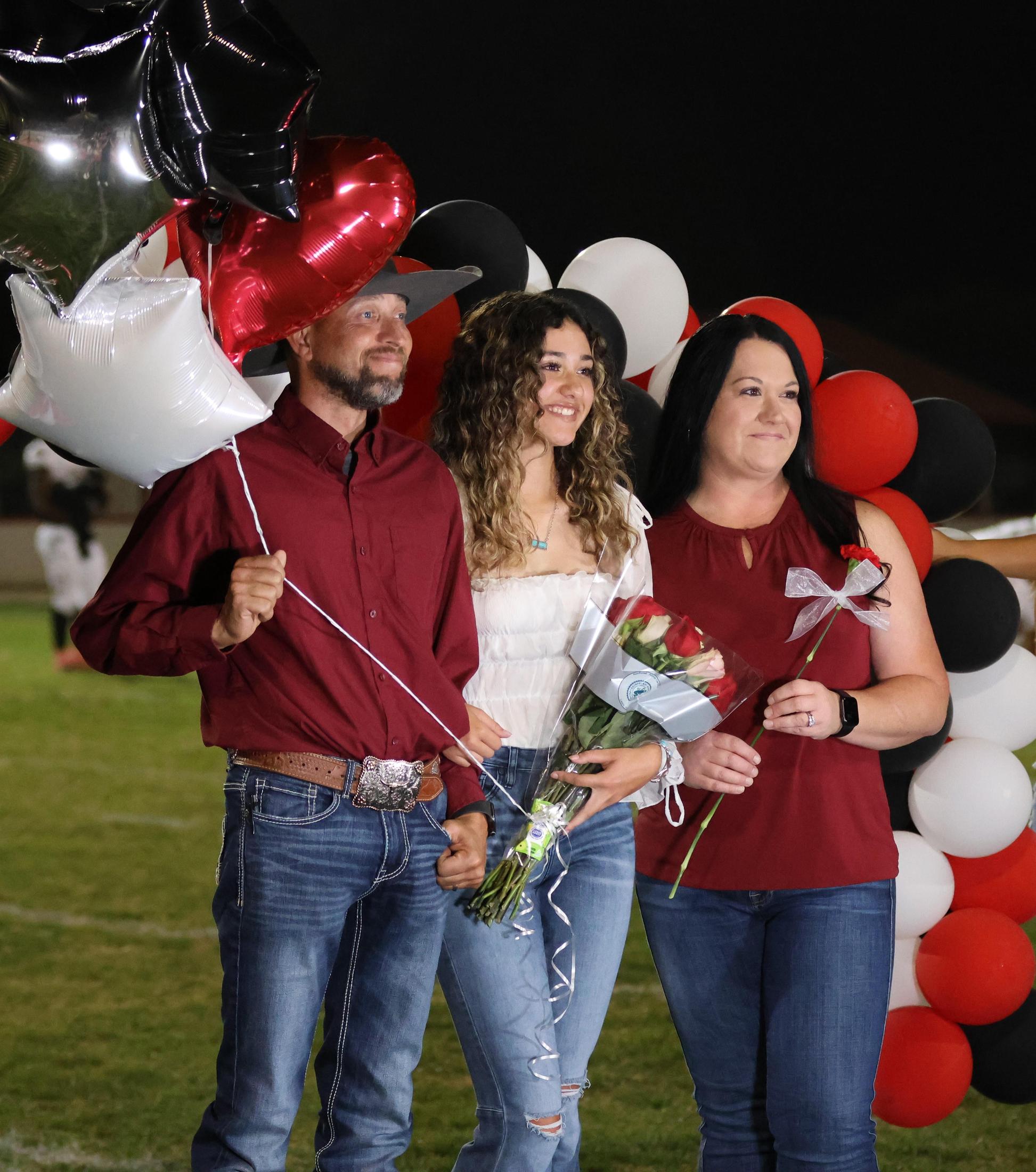 seniors and their escorts celebrating senior night