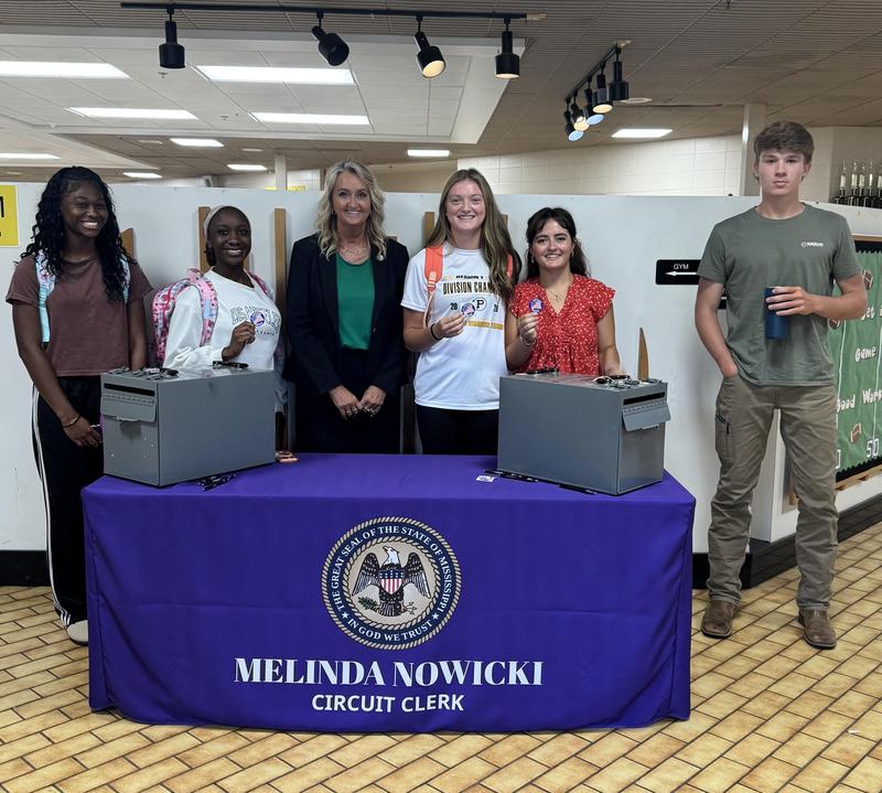 Students standing with Mrs. Nowicki.