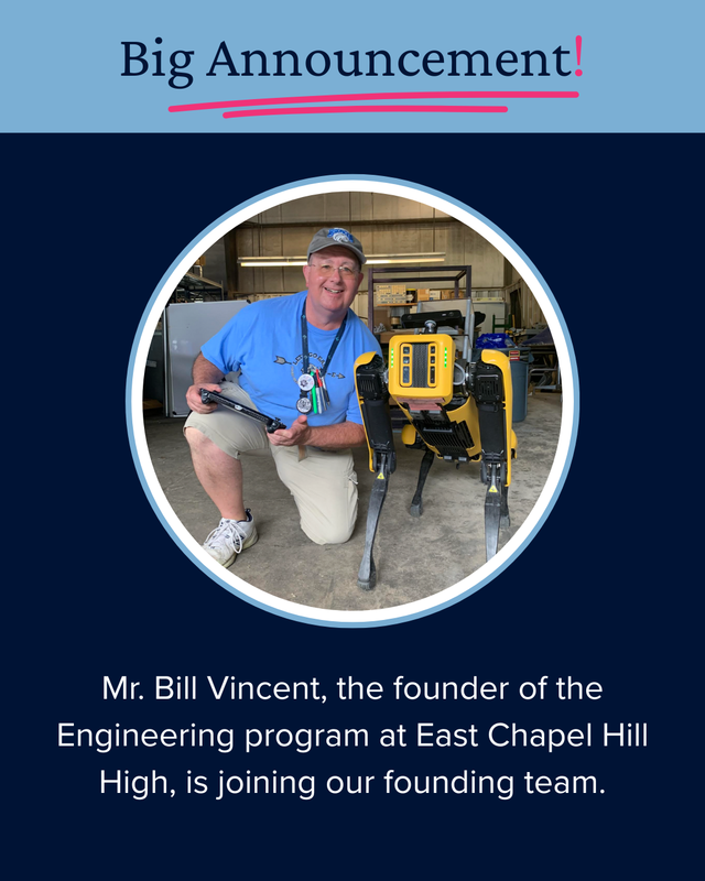 Mr. Vincent kneeling with a robot.