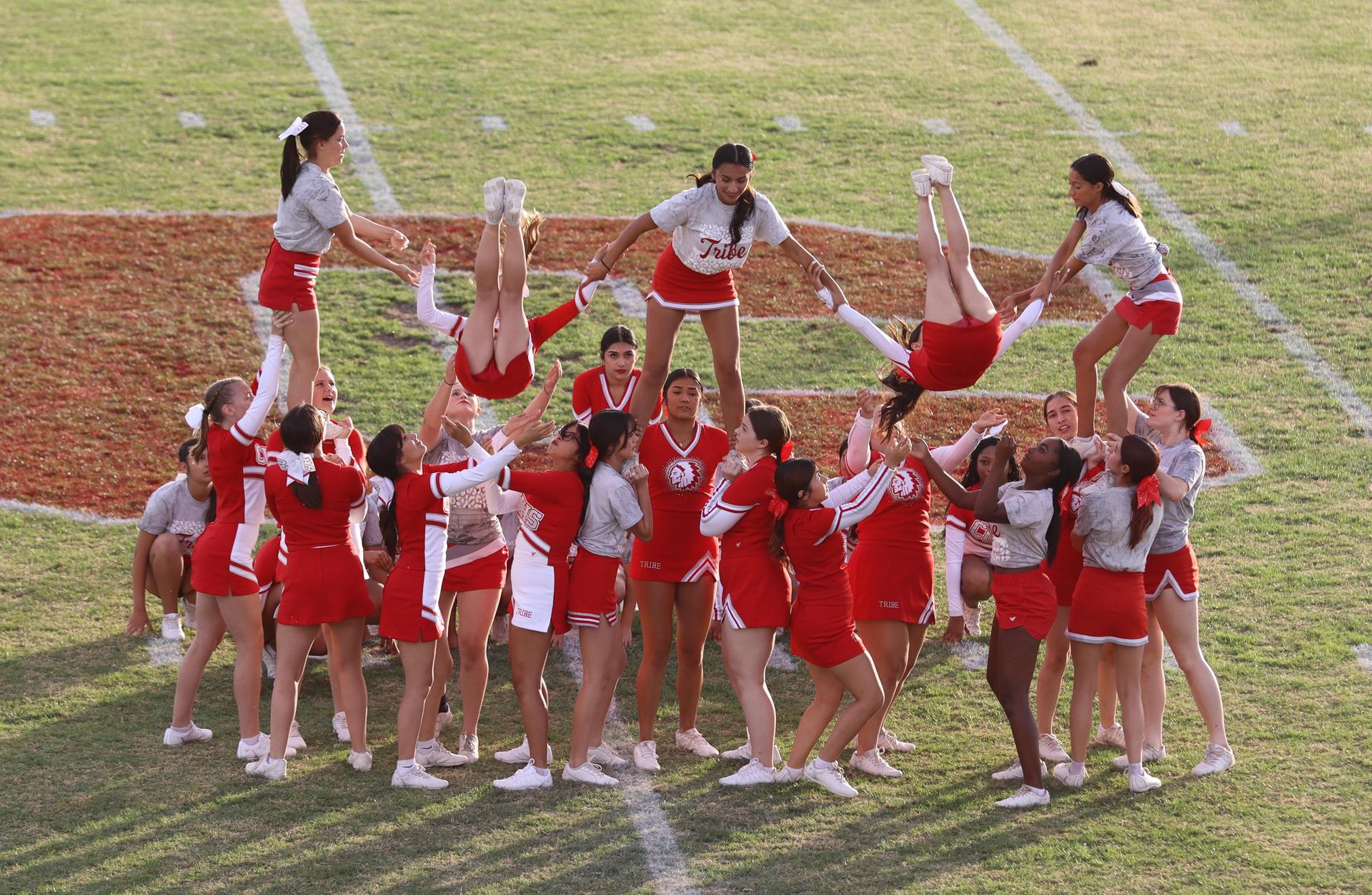 Combined cheer performing at halftime of the football game