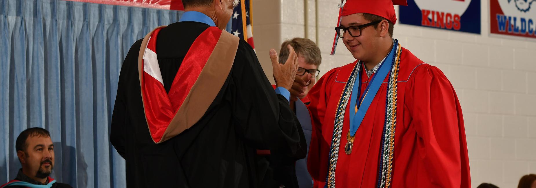 Student getting his diploma.