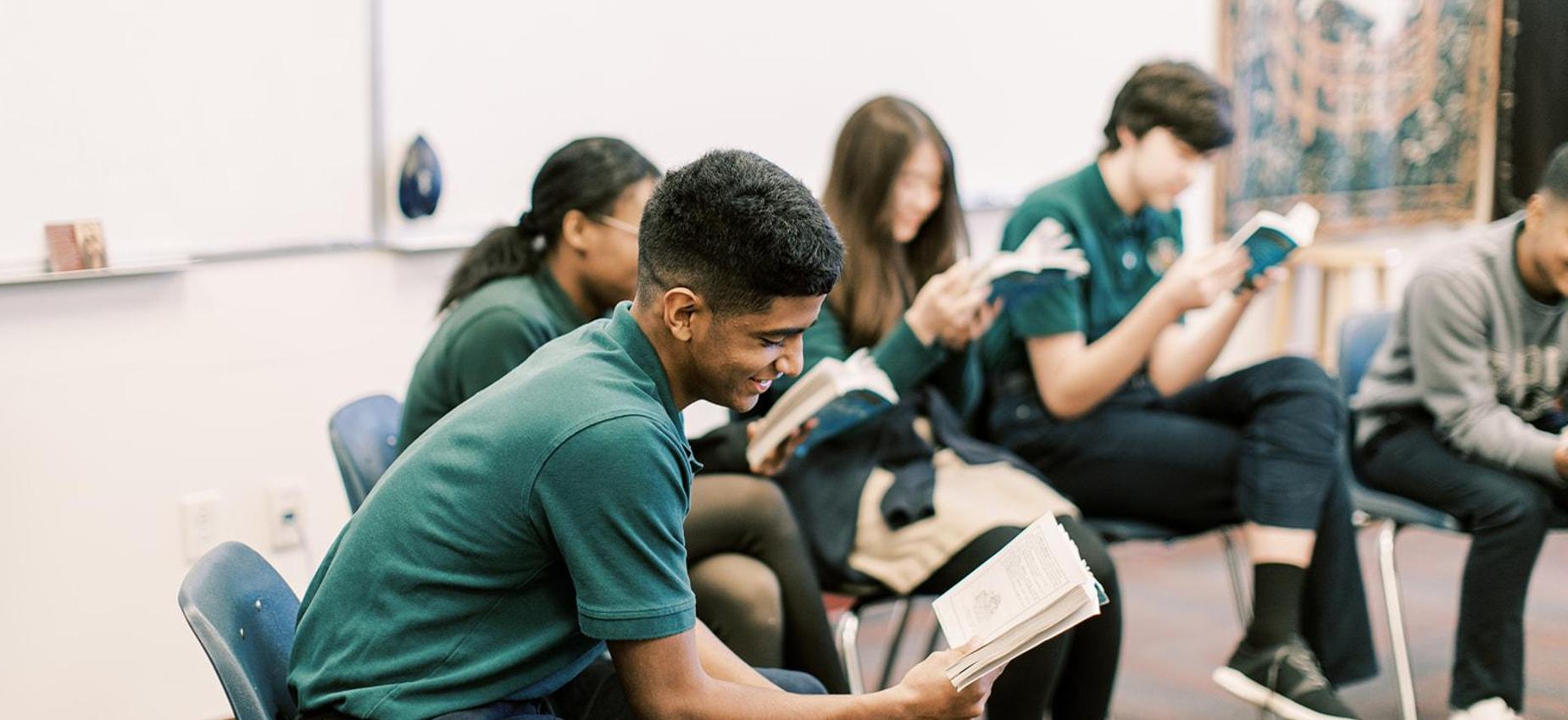 High school students read together during a seminar discussion