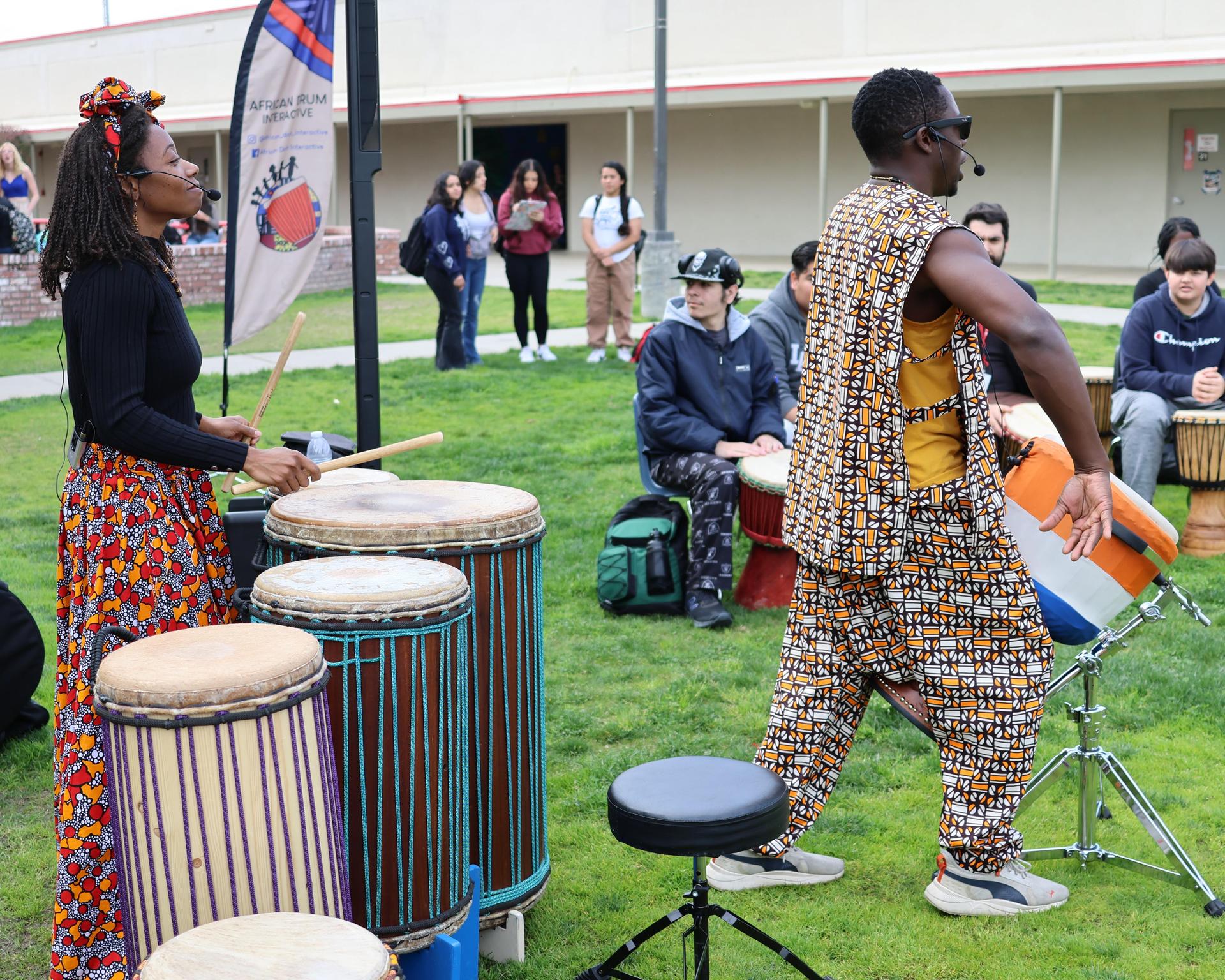 students and staff participating with the African Drum Interactive