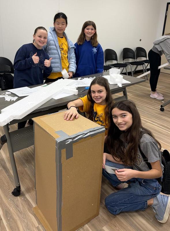 Five students posing for a photo