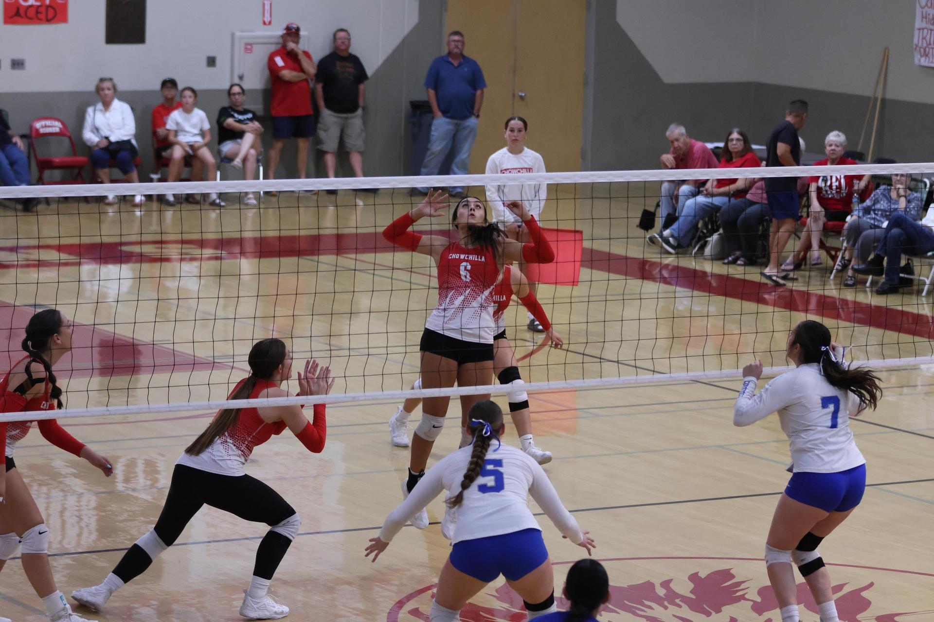 Varsity girls Volleyball playing vs. Madera 22
