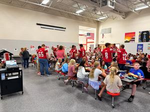 Football players and elementary lunch