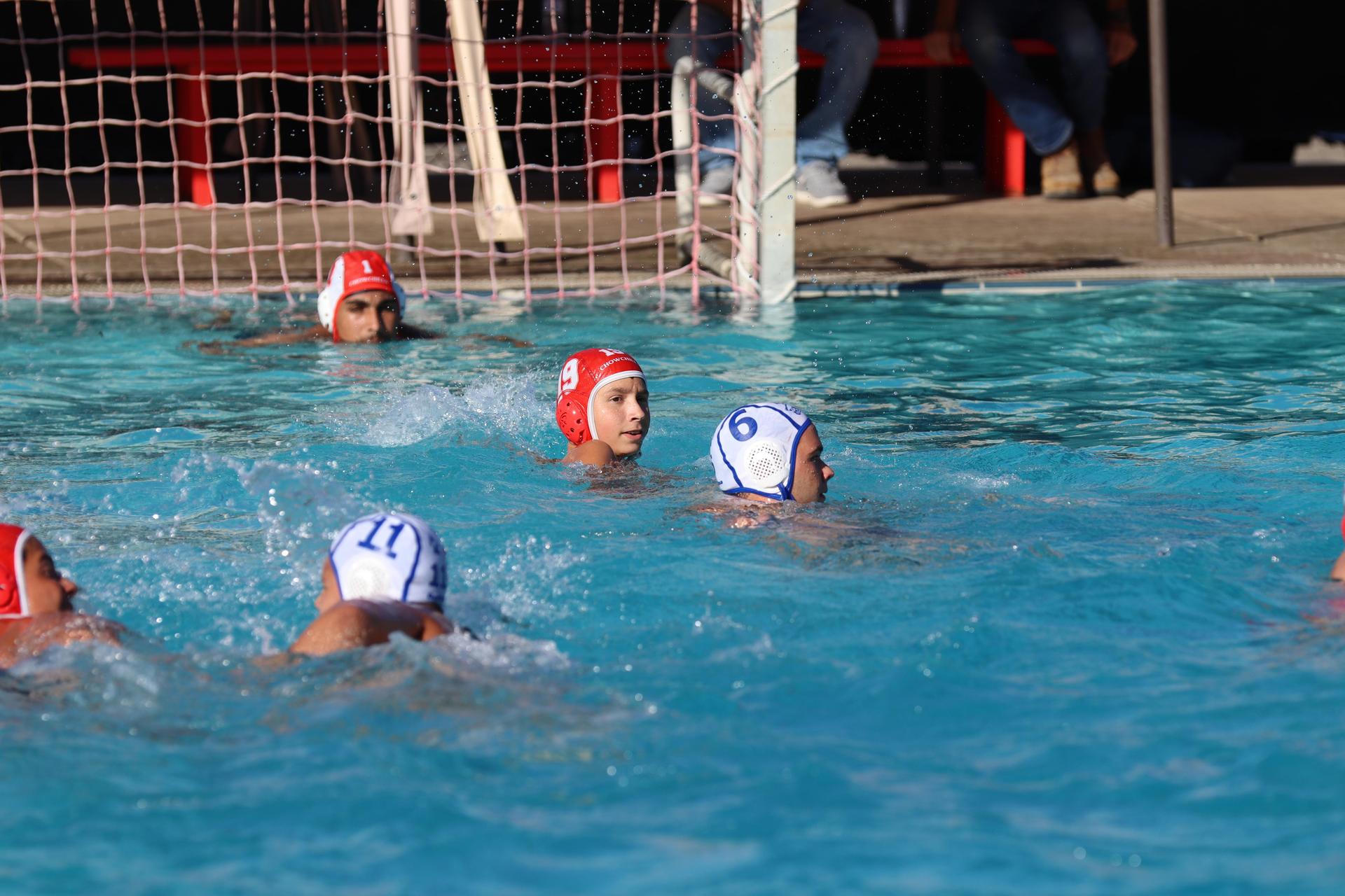 boys playing water polo against Madera
