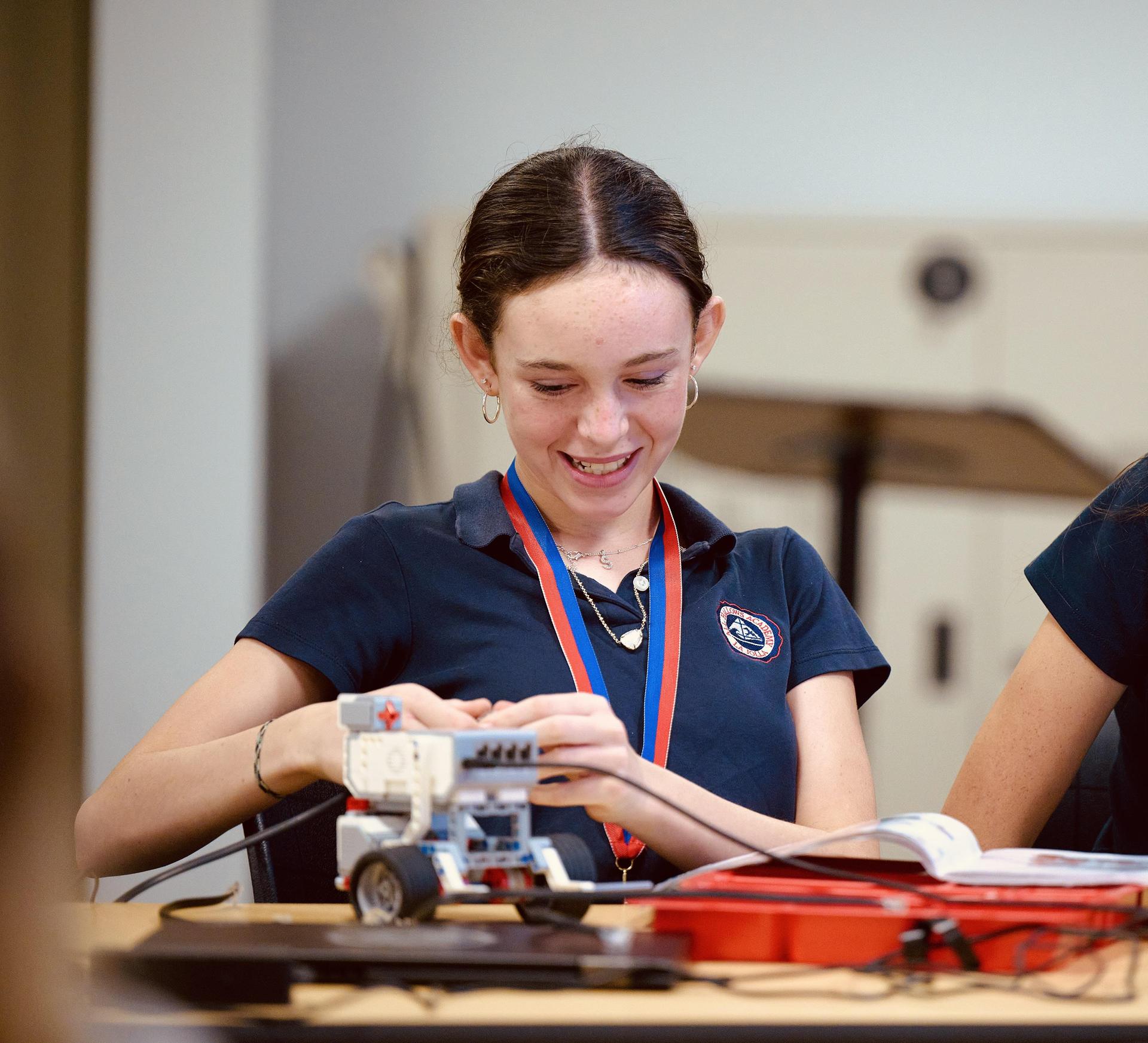 7th grade female student in LEGO Robotics elective class