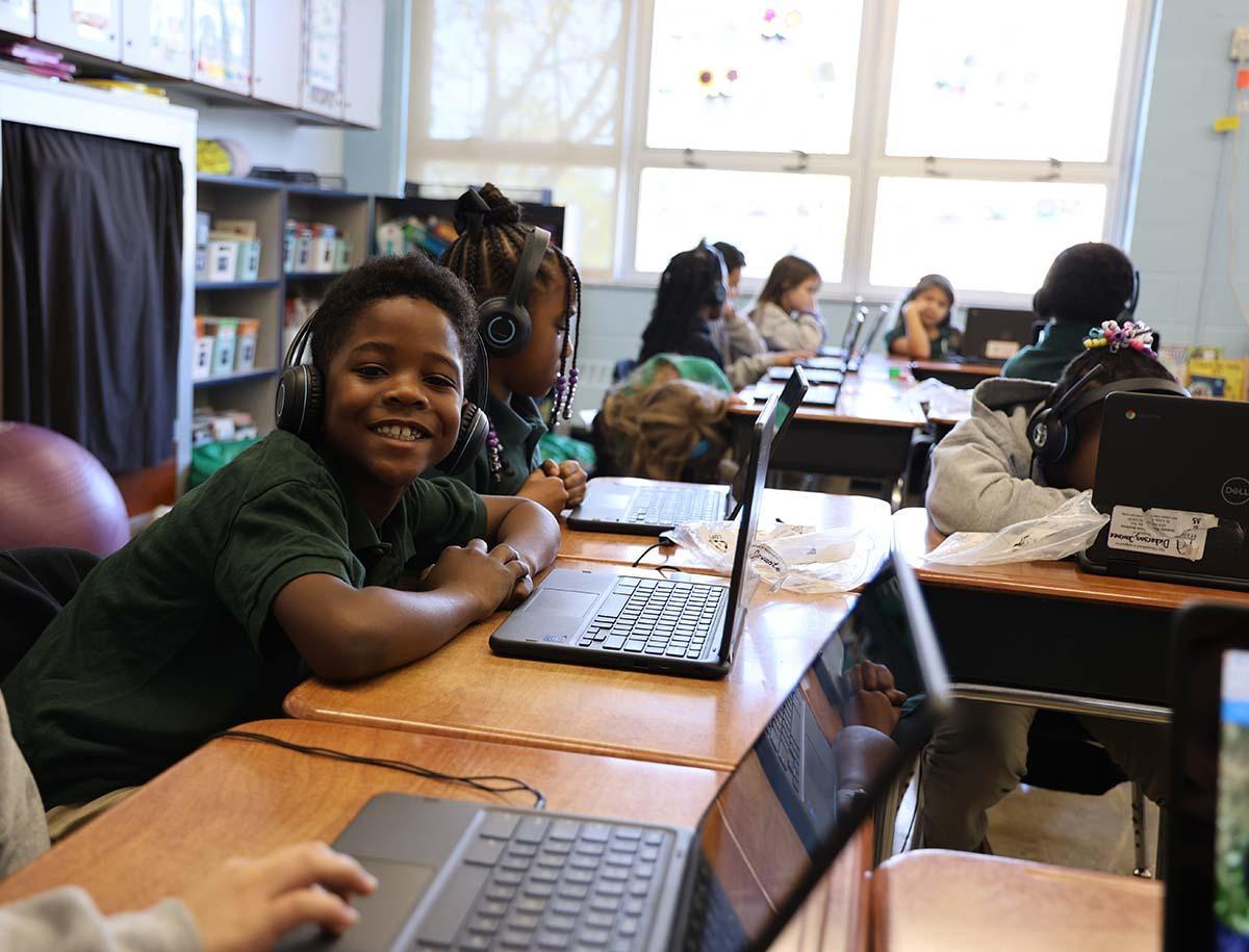 Elementary student smiling in the classroom