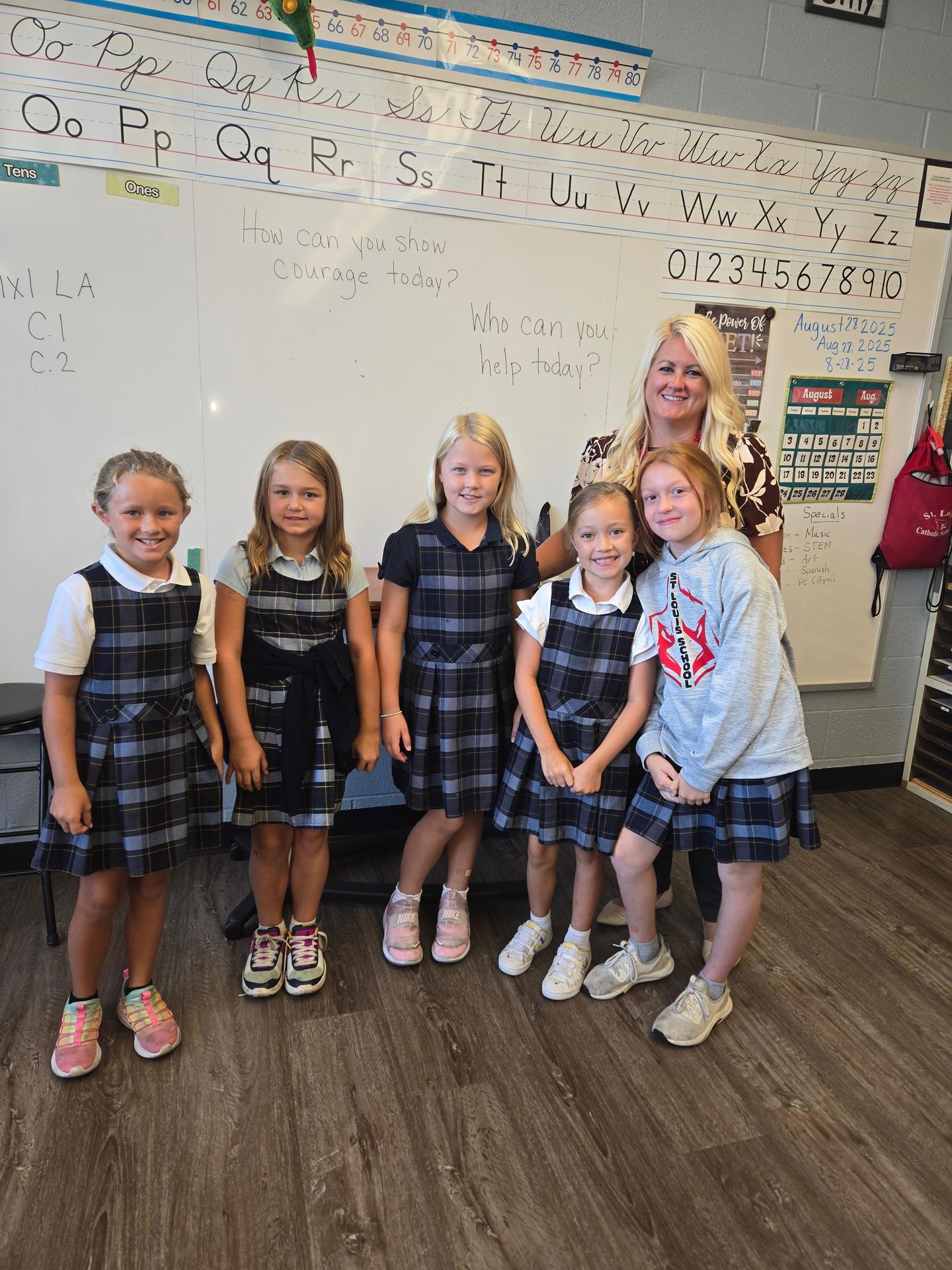 2nd grade students posing with Mrs. Goldsmith