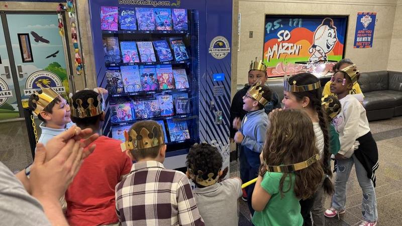 Students at the reveal of a new book vending machine