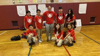 Ms. Torre and some of her students rock the red for heart disease awareness month.