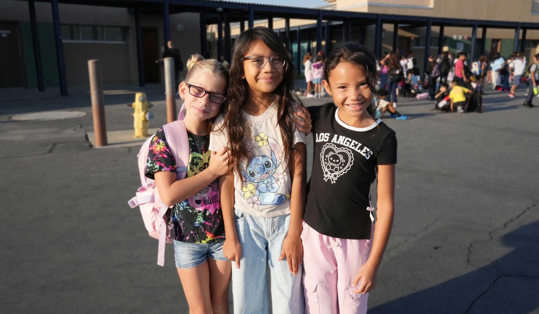 group of 3 friends on blacktop