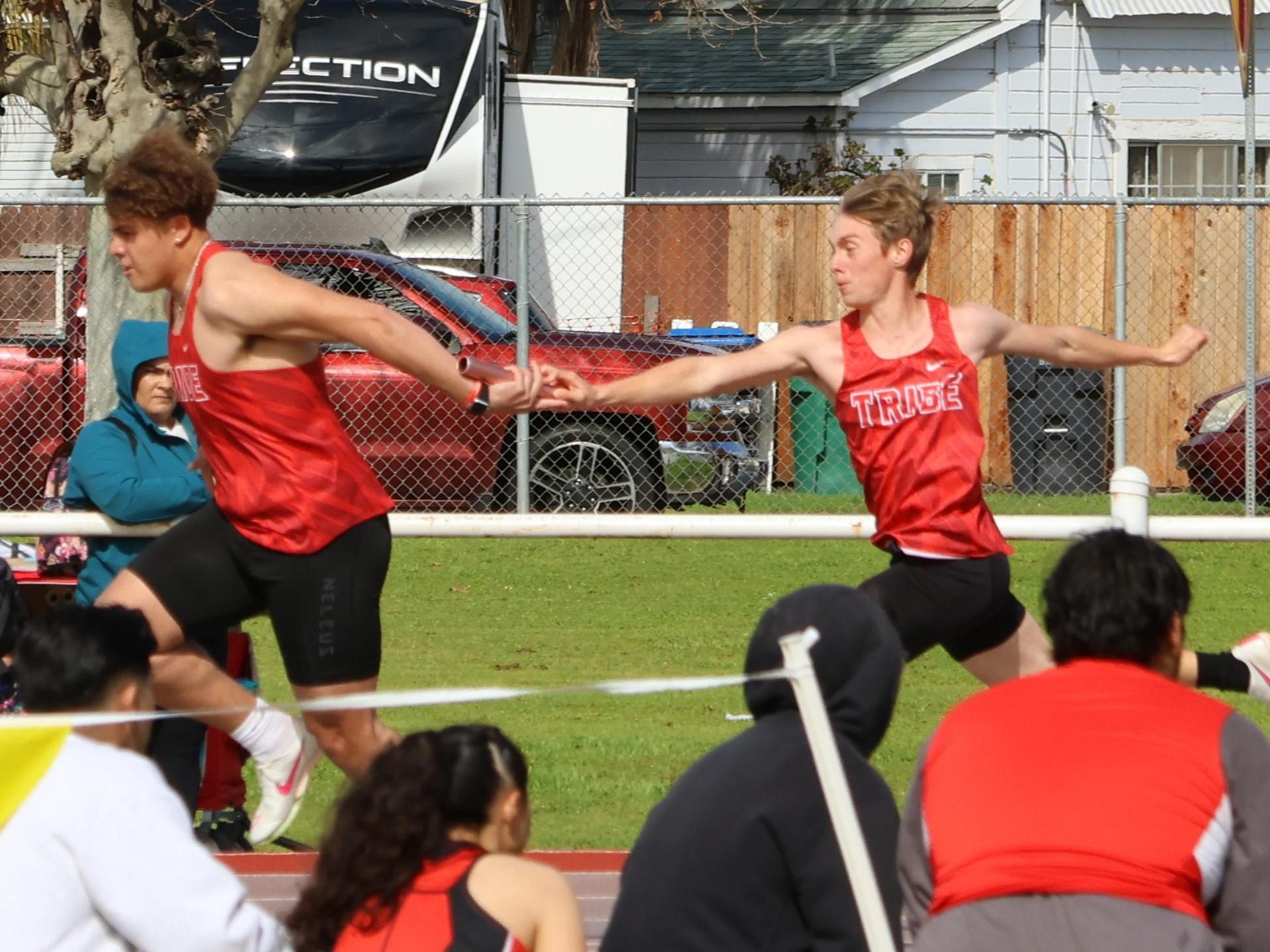 varsity boys running the four by 100 meter relay
