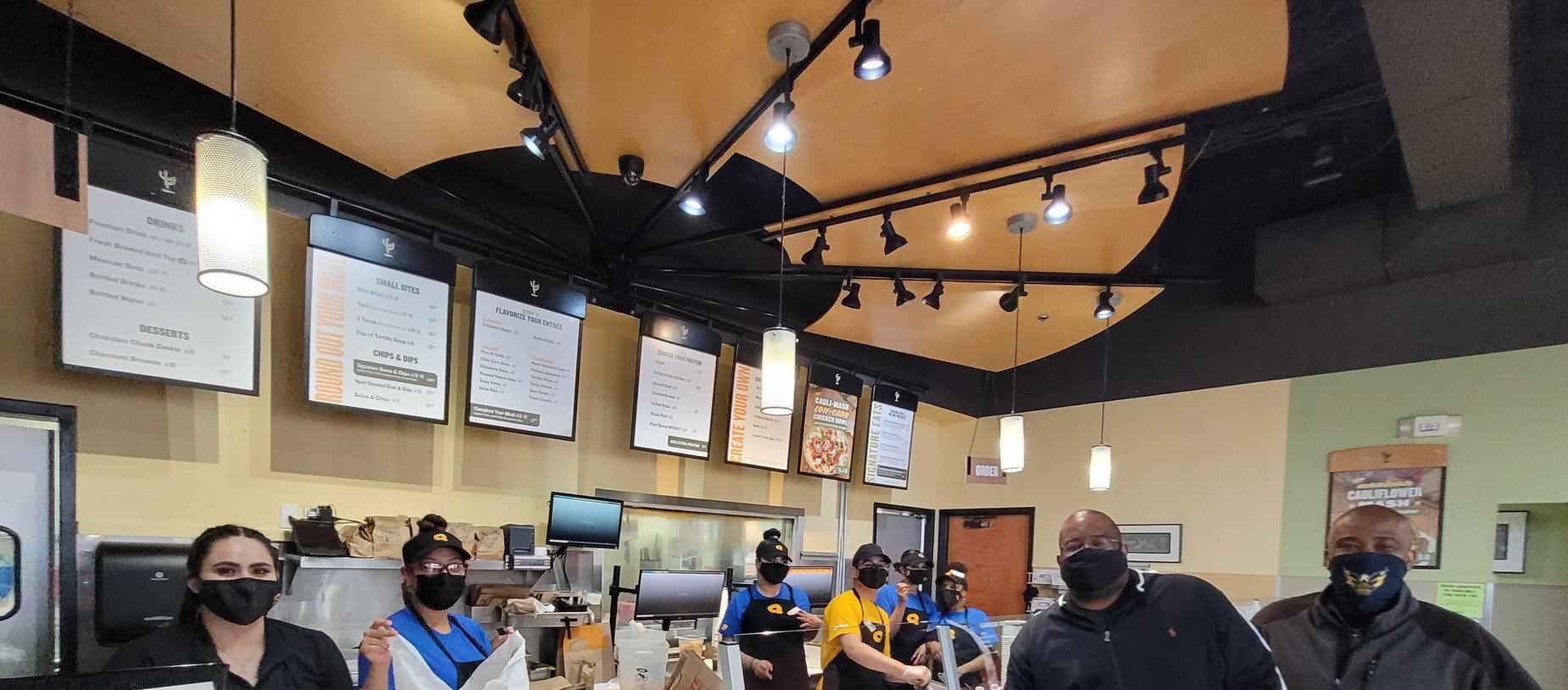 Mr. Denmark and staff member at QDoba Spirit Night