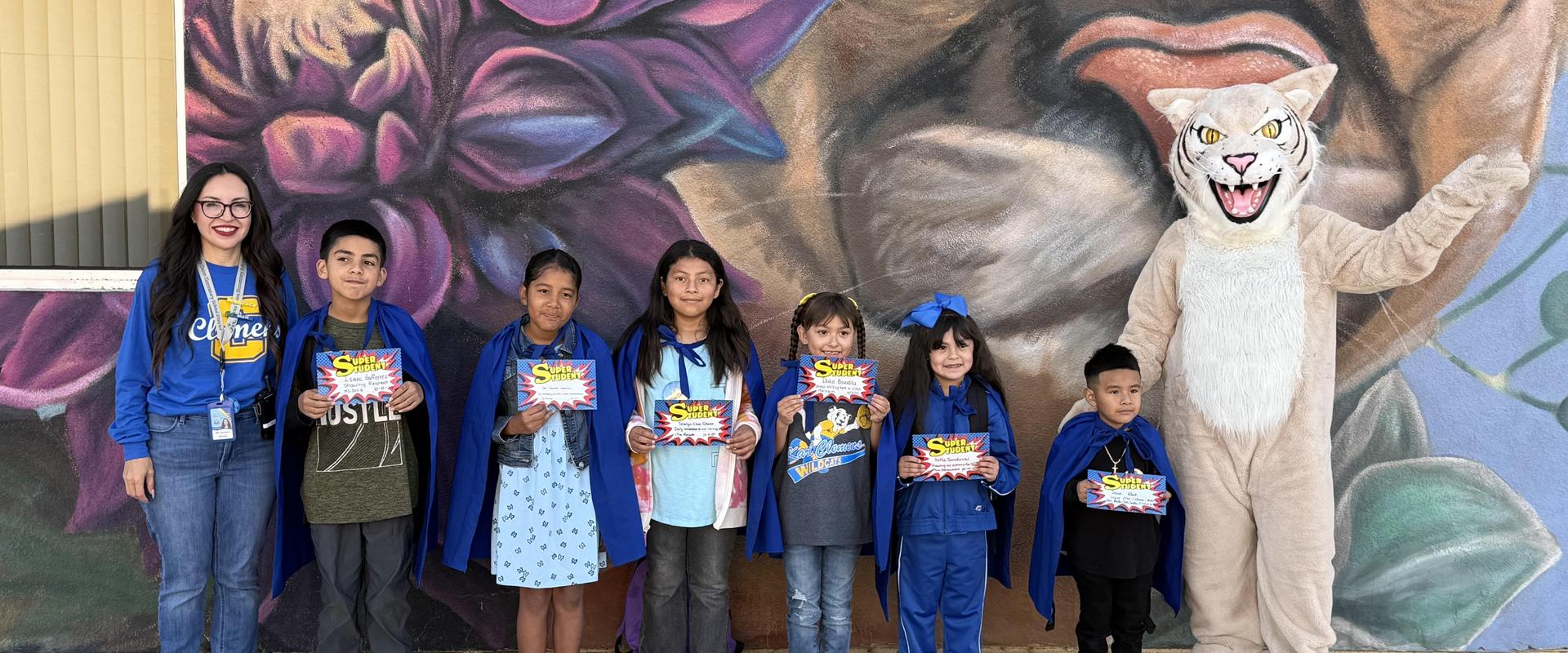 Super students with principal and vice principal