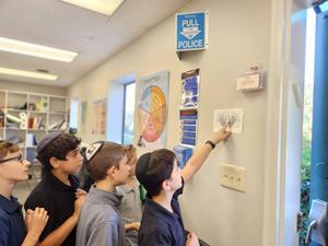 A group of students work together to interpret the next clue.