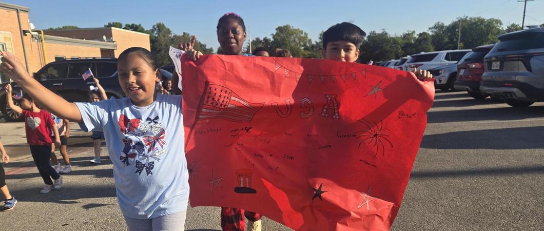 Children holding a 9/11 remembrance poster.