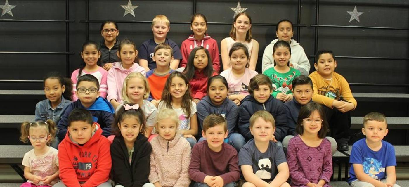 Students on stage for student of the month.