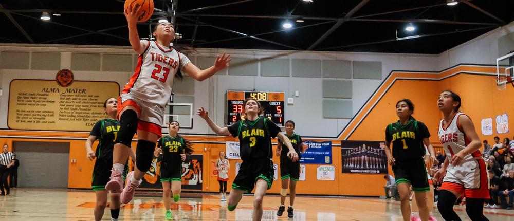 girls playing basketball in the gym
