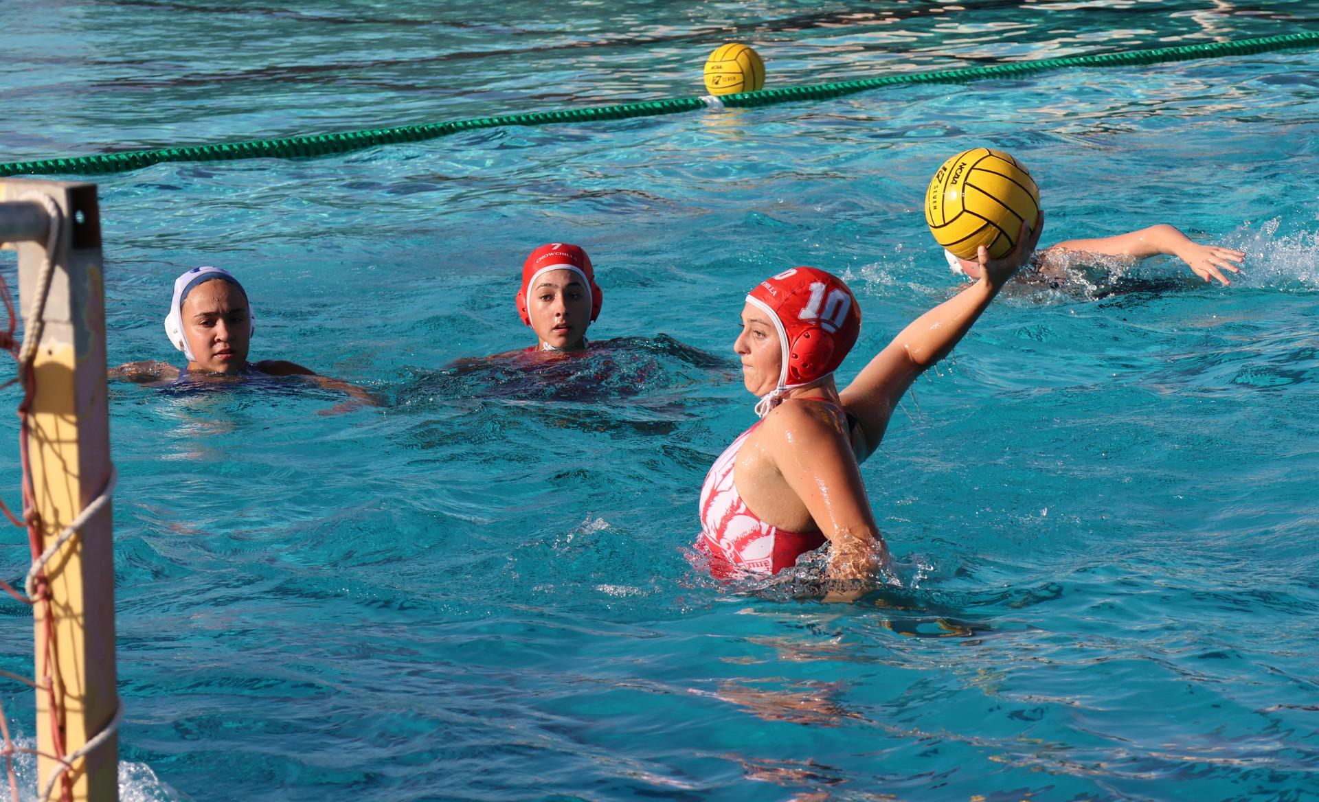 girls playing water polo against Sanger West