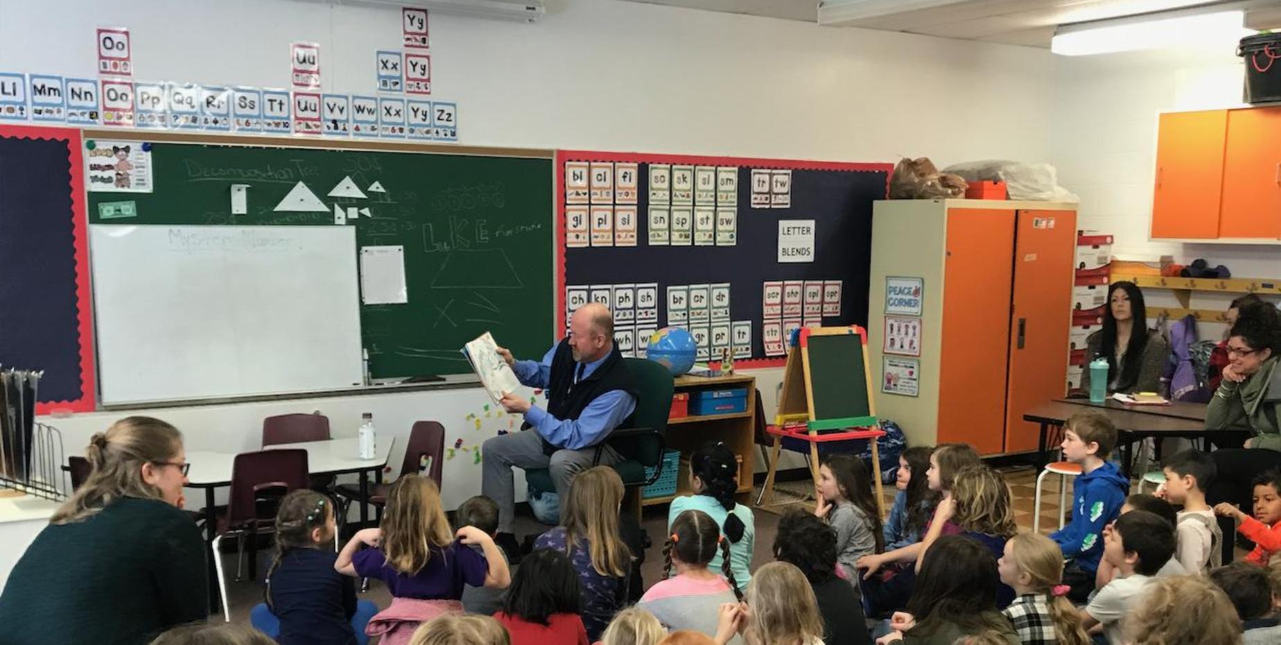students in classroom listening to read aloud