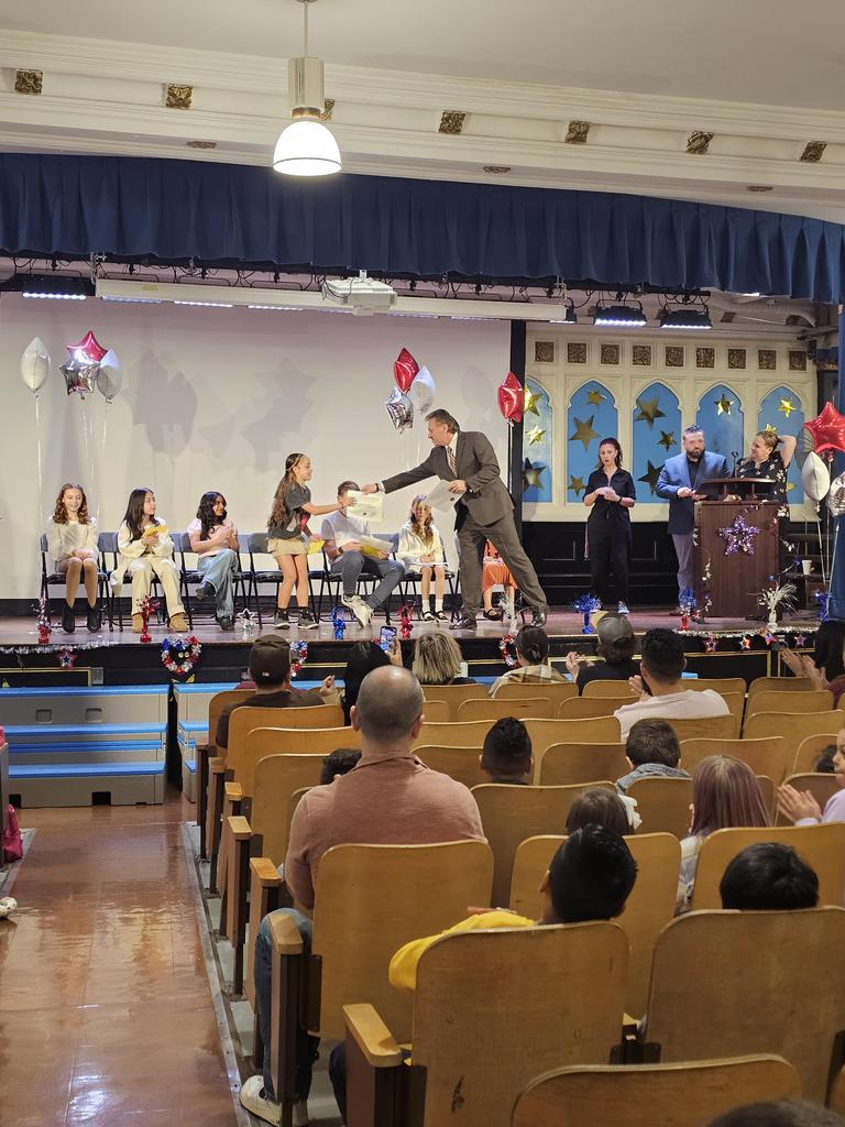 Student receiving their certificate