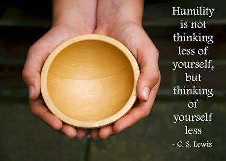 hands holding wooden bowl with quote about humility