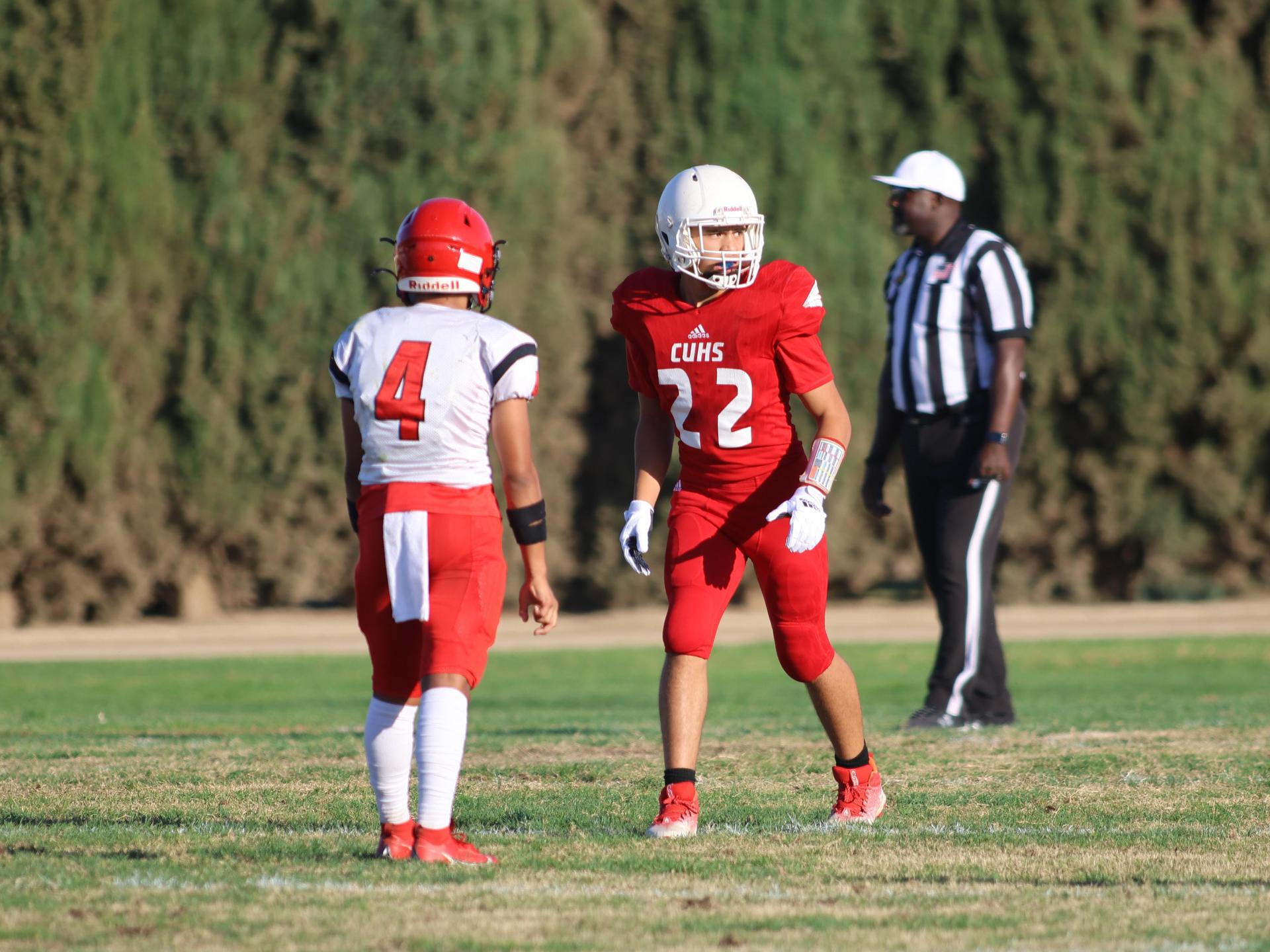junior varsity football players in action against Fowler