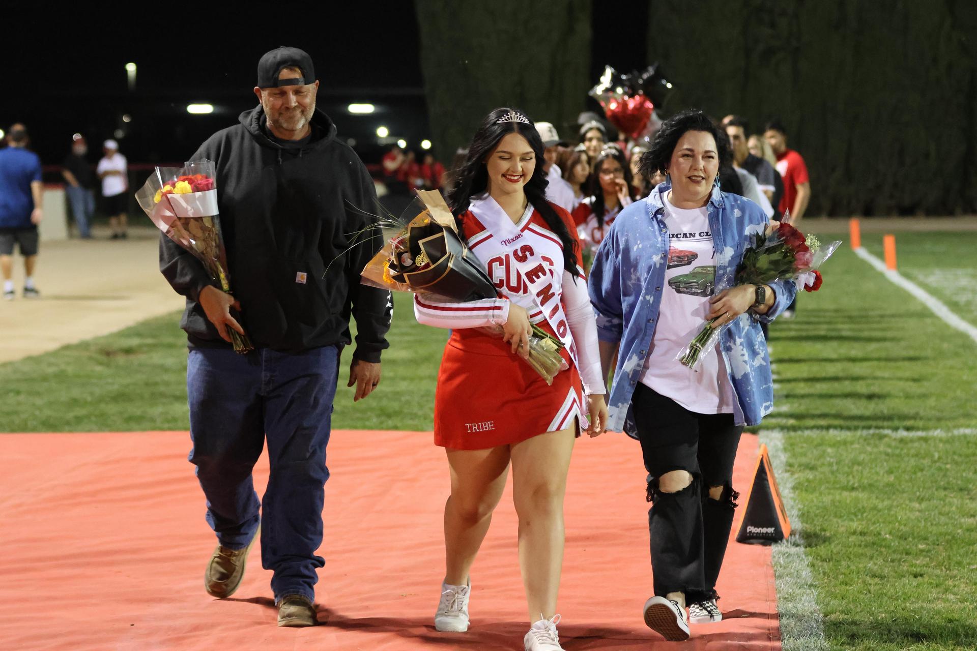 seniors and their escorts celebrating senior night