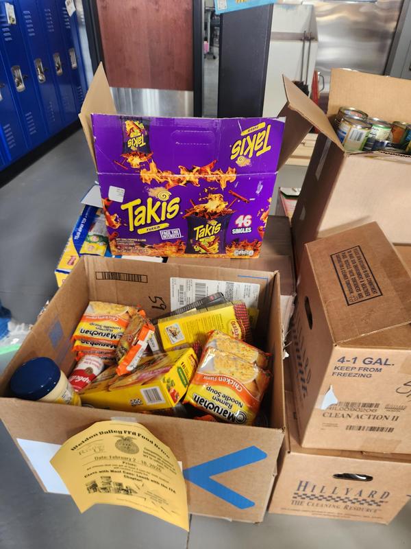 Boxes of canned food that was collected to donate.